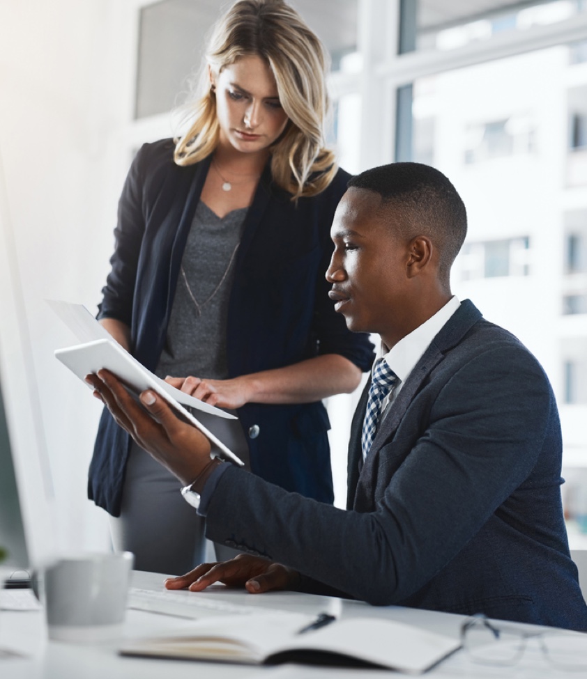 Shot of two businesspeople working together in an office